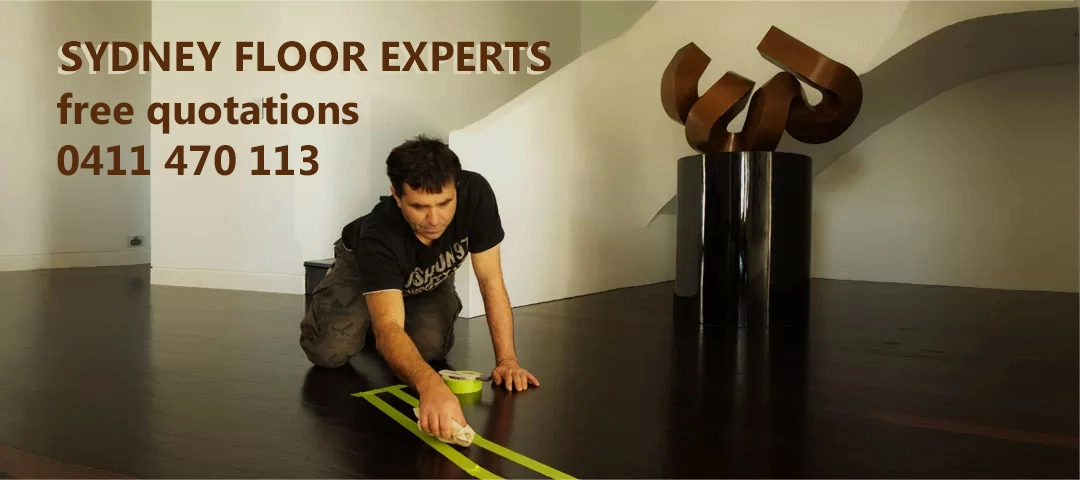 a man painting a floor